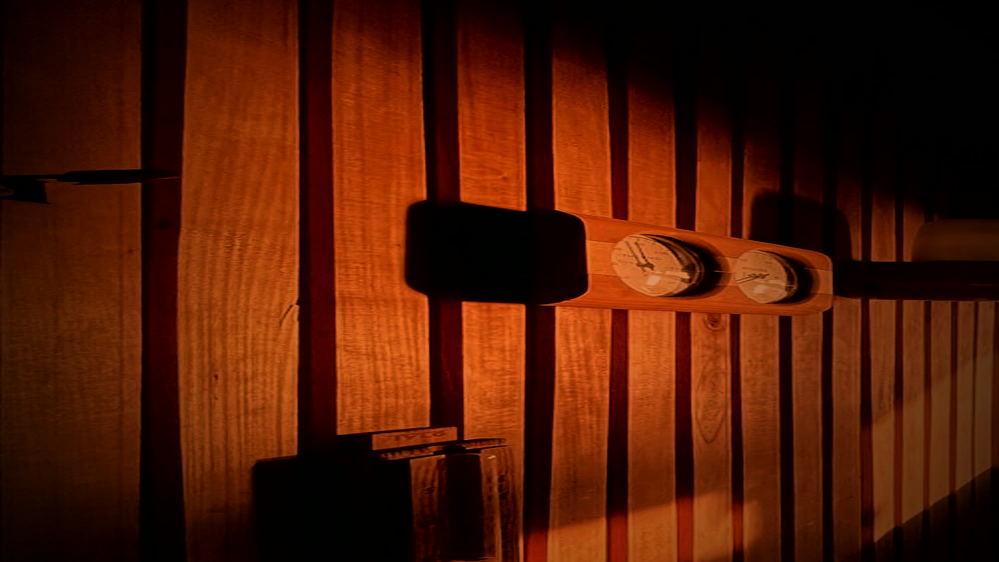 Warm cedar sauna wall detail with no exterior window view