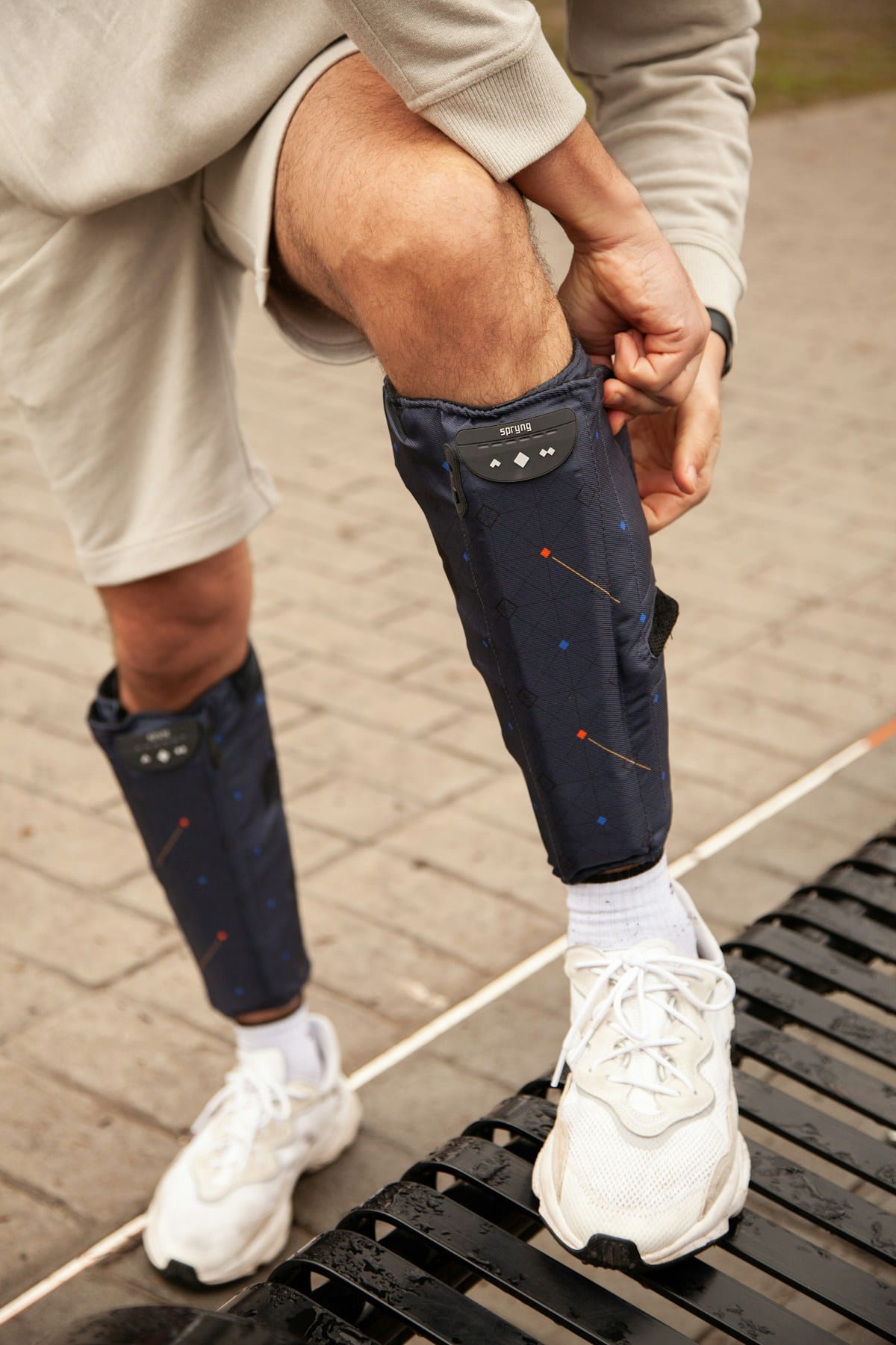 Normatec pneumatic compression boots on legs